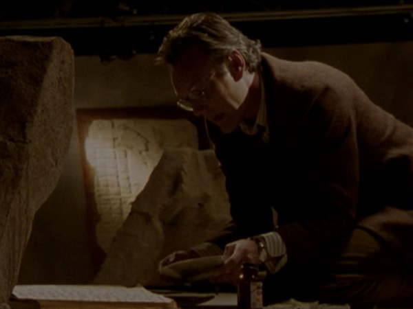 Giles tries to re-assemble the seal in the museum.