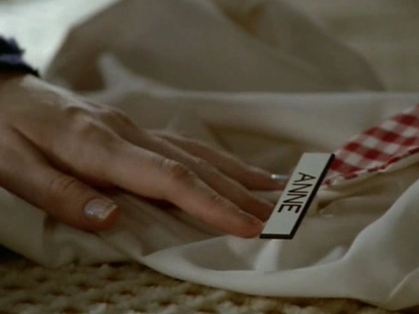 A shot of Buffy's old waitress uniform, with the name tag reading 'Anne'.