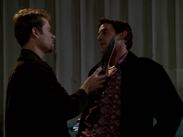 Jack O'Toole caresses Xander's cheek with a large knife.
